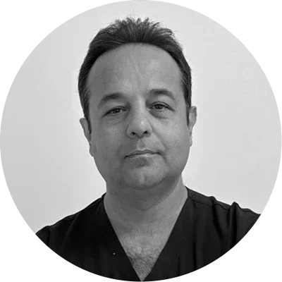 Professional Headshot Of Provider Wearing Clinical Scrubs